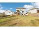 Exterior view of a home with a fenced backyard, lawn, and a deck accessible by stairs at 139 Rushing View Gln, Dallas, GA 30157