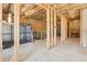 Unfinished basement with exposed wood framing, insulation, and concrete flooring ready for customization at 139 Rushing View Gln, Dallas, GA 30157