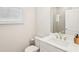 Bathroom features single sink vanity with modern faucet and adjacent toilet at 139 Rushing View Gln, Dallas, GA 30157