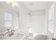 Bright bathroom featuring single sink vanity, framed mirror, modern lighting, and a shower/tub combo at 139 Rushing View Gln, Dallas, GA 30157