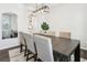 Dining room featuring modern lighting, a dining table with seating for six, and natural light from the window at 139 Rushing View Gln, Dallas, GA 30157