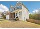 Charming two-story home with a stone and siding facade, covered porch, and manicured landscaping at 139 Rushing View Gln, Dallas, GA 30157