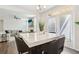 Open-concept kitchen with a central island, breakfast bar, and seamless flow into the adjacent living space at 139 Rushing View Gln, Dallas, GA 30157