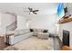 Spacious living room with a fireplace, large sectional sofa, ceiling fan and a flat screen television at 139 Rushing View Gln, Dallas, GA 30157