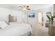 Spacious primary bedroom featuring neutral paint, plush carpet, ceiling fan, and ensuite bathroom access at 139 Rushing View Gln, Dallas, GA 30157