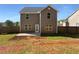 Expansive backyard featuring a lush green lawn and a charming patio area perfect for outdoor entertaining at 280 Mcgiboney Ln, Covington, GA 30016