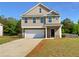 Charming two-story home with a well-manicured lawn and an attached garage at 280 Mcgiboney Ln, Covington, GA 30016