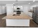 Bright kitchen with granite counters, stainless steel appliances, and a large center island at 280 Mcgiboney Ln, Covington, GA 30016
