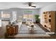 Bright living room featuring modern furniture, a ceiling fan, and a view of the backyard at 280 Mcgiboney Ln, Covington, GA 30016