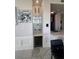 Elegant bar area with marble countertops, glass shelving, a wine fridge and modern lighting, next to the kitchen at 285 Centennial Olympic Park Dr # Ph 1-4, Atlanta, GA 30313