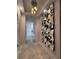 Bright hallway with marble floors, a modern mirror feature wall and a decorative light fixture at 285 Centennial Olympic Park Dr # Ph 1-4, Atlanta, GA 30313