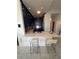 Modern kitchen with blue cabinets, a white marble countertop, stainless steel appliances, and bar stool seating at 285 Centennial Olympic Park Dr # Ph 1-4, Atlanta, GA 30313