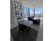 Contemporary living room featuring marble tile floors, modern furniture, a decorative mirror, and expansive city views at 285 Centennial Olympic Park Dr # Ph 1-4, Atlanta, GA 30313