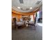 Comfortable condo lobby with chairs, carpet, wood accents, and a bar area at 285 Centennial Olympic Park Dr # Ph 1-4, Atlanta, GA 30313