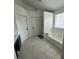 Large bathroom featuring a double sink vanity, a soaking tub, and a bright window at 2895 Dominion Walk Ln, Snellville, GA 30078