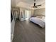 Large bedroom with tray ceiling, ceiling fan, and ensuite bathroom access at 2895 Dominion Walk Ln, Snellville, GA 30078