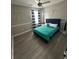 Cozy bedroom featuring a ceiling fan, striped curtains, and unique wall decor at 2895 Dominion Walk Ln, Snellville, GA 30078