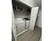 Convenient laundry room with modern washer and dryer, and easy access to storage at 2895 Dominion Walk Ln, Snellville, GA 30078