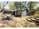 Charming backyard featuring a patio with outdoor dining and lush landscaping at 4449 Lashley Dr, Tucker, GA 30084