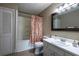Bathroom with tub, shower and floral shower curtain at 4449 Lashley Dr, Tucker, GA 30084