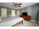 Bedroom with ceiling fan, furniture, large window and ensuite bathroom at 4449 Lashley Dr, Tucker, GA 30084