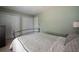 Comfortable bedroom featuring a bed with a patterned quilt, and a double door closet at 4449 Lashley Dr, Tucker, GA 30084