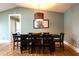 Well lit dining room features a modern hanging light fixture and table for 6 at 4449 Lashley Dr, Tucker, GA 30084