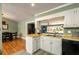 Kitchen view looks into a living room with a large window and natural light at 4449 Lashley Dr, Tucker, GA 30084