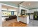 Kitchen with yellow countertops and stainless steel appliances that leads to a bright living room at 4449 Lashley Dr, Tucker, GA 30084