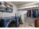 Laundry room with modern appliances and ample storage shelving at 4449 Lashley Dr, Tucker, GA 30084