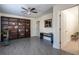 Living room boasting a large bookcase, ceiling fan, and neutral paint at 4449 Lashley Dr, Tucker, GA 30084