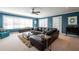 Comfortable living room with a large leather sofa and lots of natural light at 4449 Lashley Dr, Tucker, GA 30084