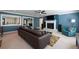 Open concept living room includes a fireplace and a view to the kitchen and dining room at 4449 Lashley Dr, Tucker, GA 30084
