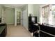 Office with neutral walls, carpet, built-in cabinet and desk at 4449 Lashley Dr, Tucker, GA 30084