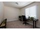Office space with natural light, desk, and tan carpet at 4449 Lashley Dr, Tucker, GA 30084