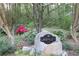 Image of the Lashley Acres community sign, stone and flowering bushes surrounding at 4449 Lashley Dr, Tucker, GA 30084