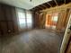 Bedroom under renovation, featuring a large window and exposed wooden framework at 852 Laurelmont Dr, Atlanta, GA 30311
