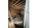 Unfinished garage interior showing exposed wood beam ceiling, wood walls, and scattered construction debris at 852 Laurelmont Dr, Atlanta, GA 30311