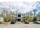 Apartment building with a parking lot and well maintained landscaping, creating an inviting atmosphere at 10104 Fairington Ridge Cir, Lithonia, GA 30038