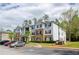 Apartment building exterior with a parking lot and manicured landscaping in a residential neighborhood at 10104 Fairington Ridge Cir, Lithonia, GA 30038