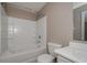 This bathroom features a shower and tub combo, a toilet, and a sink with a mirror at 10104 Fairington Ridge Cir, Lithonia, GA 30038