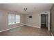 This is a bedroom with tile flooring, a window, and a tv wall mount at 10104 Fairington Ridge Cir, Lithonia, GA 30038
