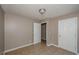 Bedroom with neutral walls, tile floors, and white doors at 10104 Fairington Ridge Cir, Lithonia, GA 30038