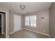 Cozy bedroom featuring tile flooring and a sun-filled window at 10104 Fairington Ridge Cir, Lithonia, GA 30038