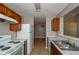 Practical kitchen with white appliances, double sink, and plenty of counter space and storage at 10104 Fairington Ridge Cir, Lithonia, GA 30038