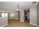 Open-concept space featuring a modern kitchen and living area with tile floors and neutral decor at 10104 Fairington Ridge Cir, Lithonia, GA 30038