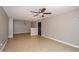 Inviting living room featuring tile flooring, a textured ceiling, and a neutral color palette at 10104 Fairington Ridge Cir, Lithonia, GA 30038