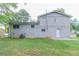View of the backyard with green grass, a patio and the back of the home in view at 3891 Northstrand Dr, Decatur, GA 30035