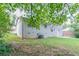 View of backyard of home surrounded by mature trees at 3891 Northstrand Dr, Decatur, GA 30035