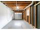 Unfinished basement with exposed wood ceiling, concrete floors and open space at 3891 Northstrand Dr, Decatur, GA 30035